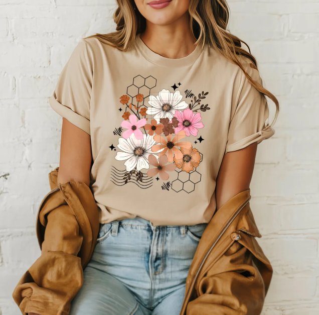 Flower Honeycombs graphic tee from Anchored Grace Boutique featuring a colorful honeycomb and flower print on a casual t-shirt.