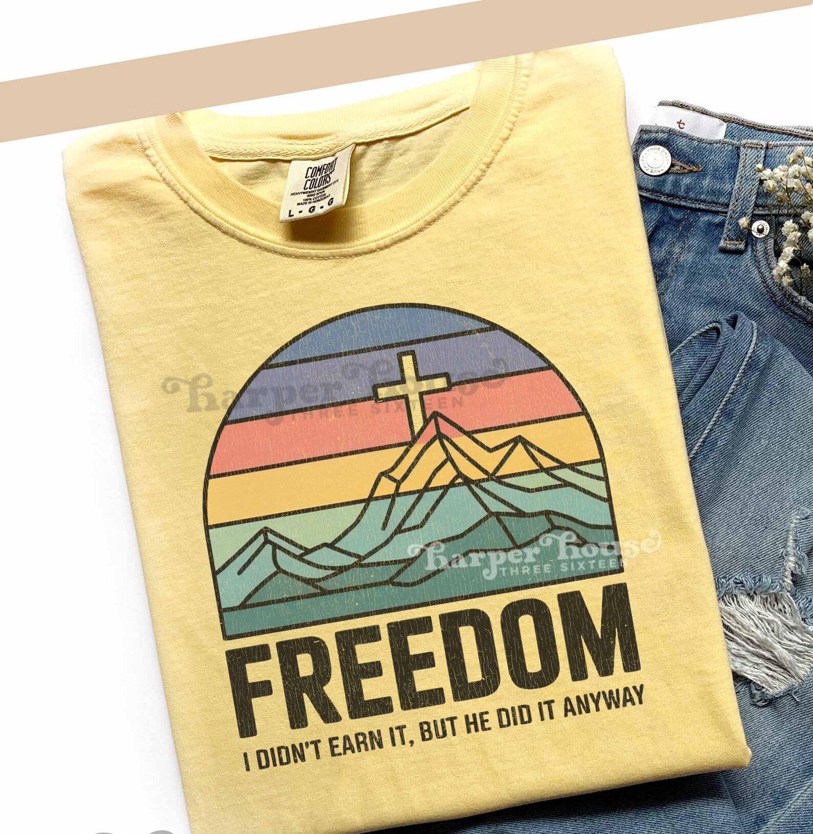 Black Freedom Graphic Tee by Anchored Grace Boutique featuring a bold, artistic graphic design on soft cotton fabric.