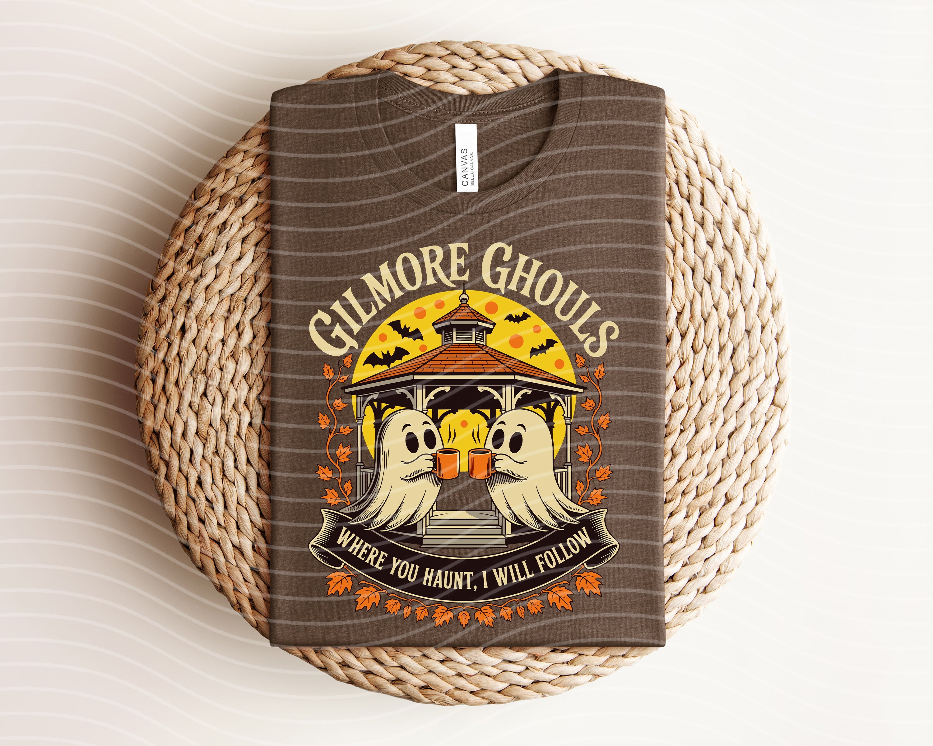 Green Gilmore Ghouls graphic tee from Anchored Grace Boutique featuring a spooky design on a casual short-sleeve shirt.