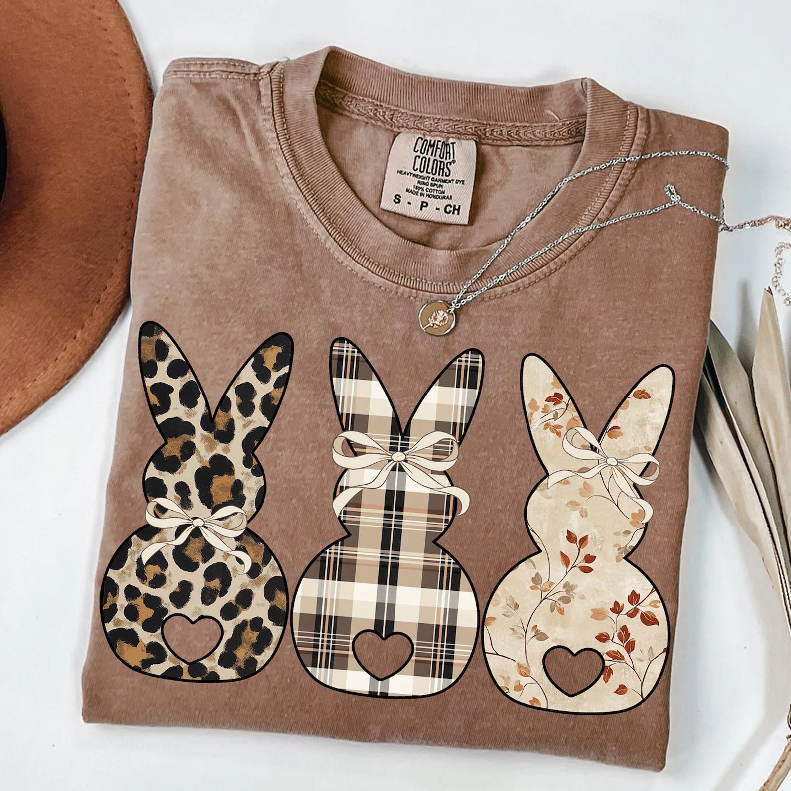 Heart Bunnies graphic tee by Anchored Grace Boutique, featuring a playful bunny design on a casual cotton t-shirt.