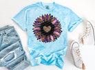 Heart flower graphic tee from Anchored Grace Boutique featuring a colorful floral heart design on a casual cotton t-shirt.