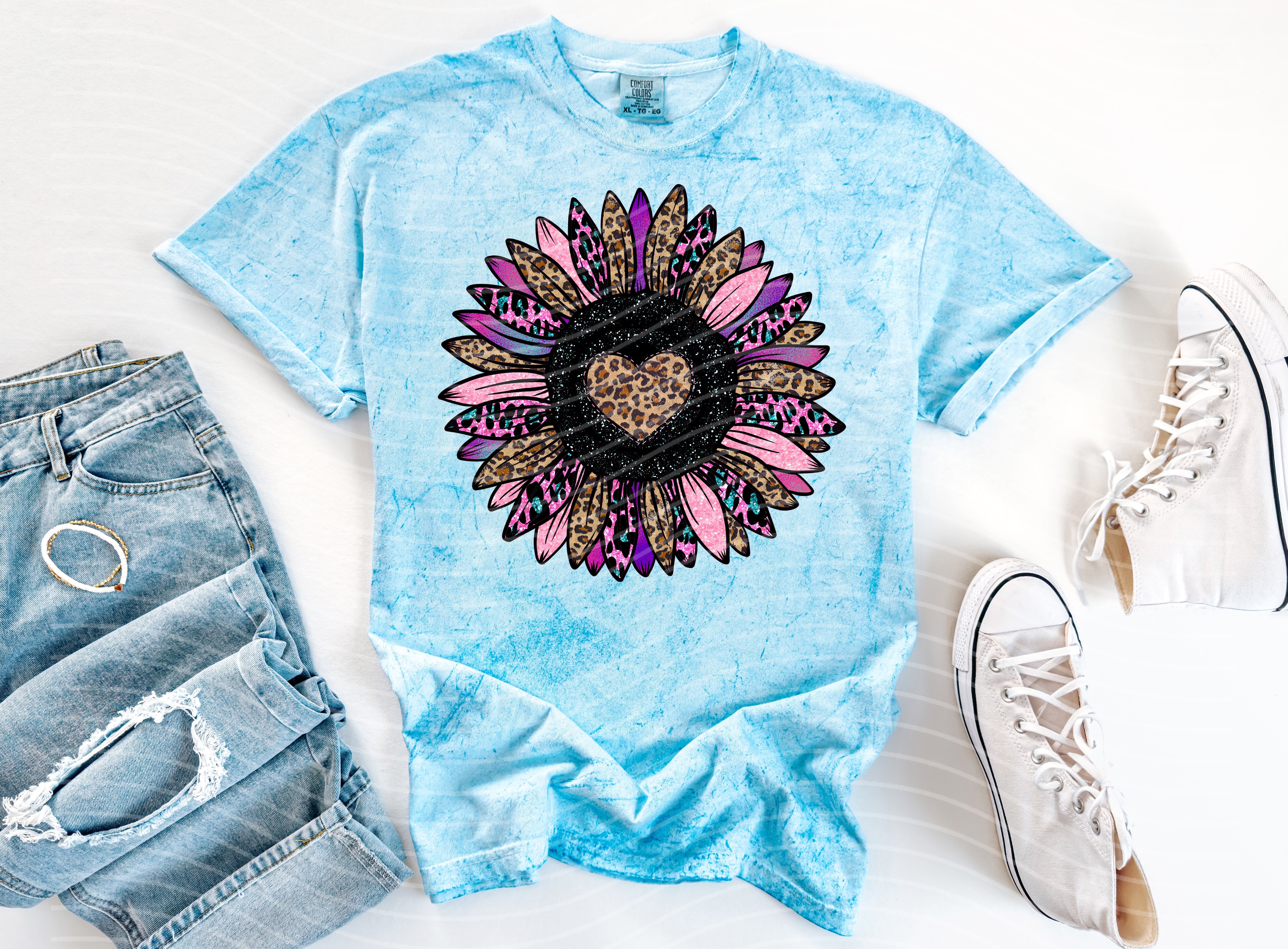 Heart flower graphic tee from Anchored Grace Boutique featuring a colorful floral heart design on a casual cotton t-shirt.