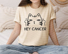 Hey Cancer graphic tee by Anchored Grace Boutique, featuring bold cancer zodiac symbol and stylish design on a casual tee shirt.