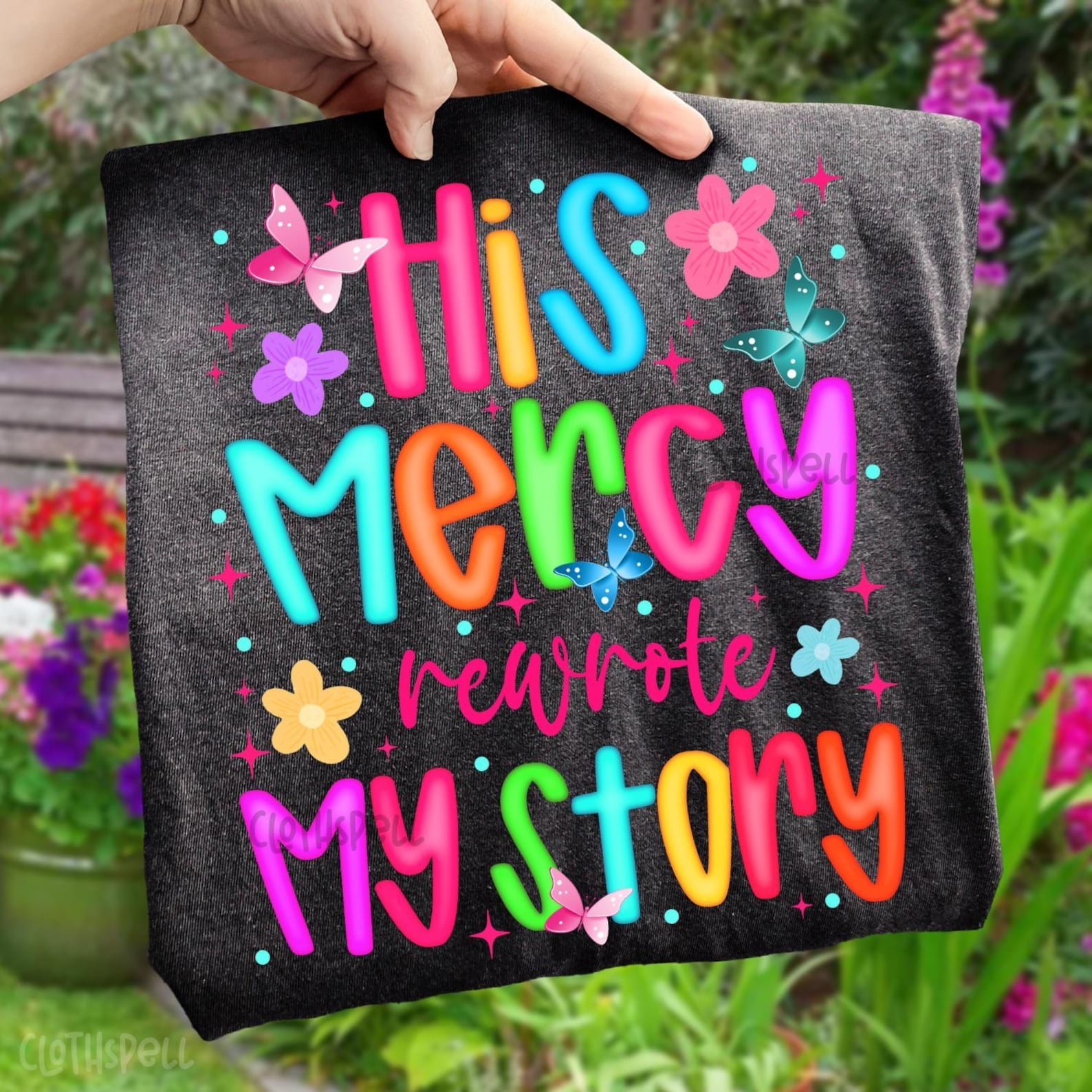 His Mercy Rewrote My Story graphic tee by Anchored Grace Boutique, featuring a stylish design on a comfortable T-shirt for men.