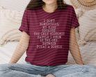 Black graphic tee with "I Don't Homeschool My Kids" text, featuring a casual style from Anchored Grace Boutique.