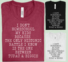 Black graphic tee from Anchored Grace Boutique with the phrase "I Don't Homeschool My Kids" printed in white text.