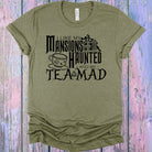 Anchored Grace Boutique graphic tee featuring spooky mansion and mad tea design, casual unisex t-shirt for Halloween or gothic style.