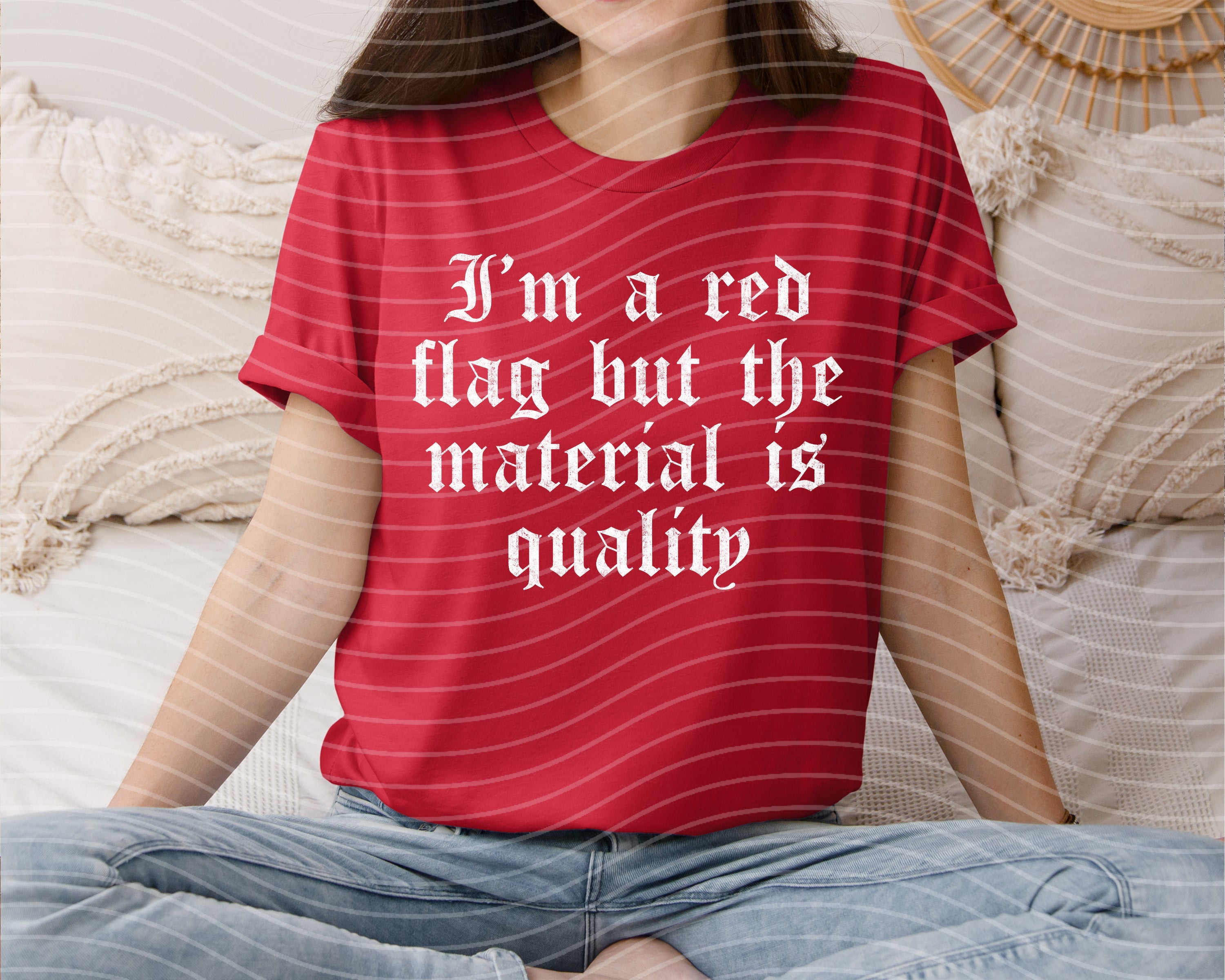 Red graphic tee with "I'm a Red Flag" text from Anchored Grace Boutique displayed on a hanger.