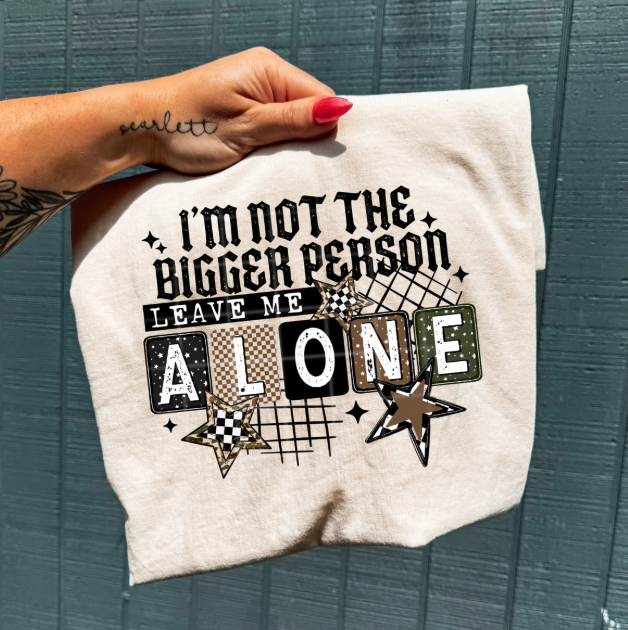 Anchored Grace Boutique "I'm Not Bigger Person" graphic tee featuring a casual black T-shirt with white text design.
