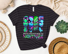 Black graphic tee from Anchored Grace Boutique featuring the phrase "I'm Ok with Being the Nightmare" in bold lettering.