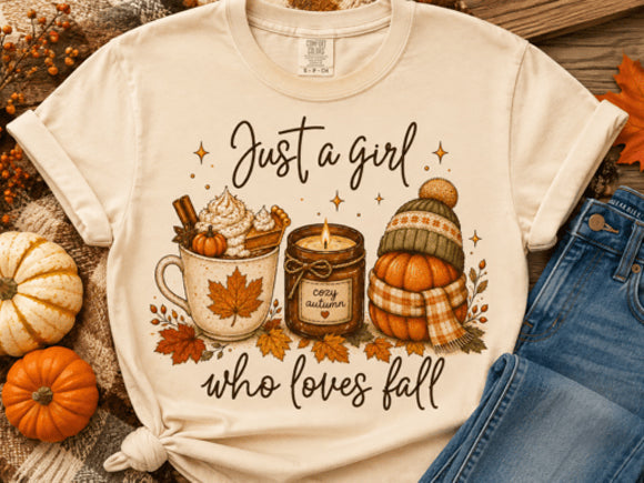 Rust-colored graphic tee from Anchored Grace Boutique featuring the phrase "Just a Girl Who Loves Fall" in stylish lettering.