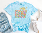 Black graphic tee from Anchored Grace Boutique with "Just Pray" slogan and prayer-themed design on the front.