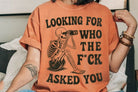 Black graphic tee by Anchored Grace Boutique featuring bold "Looking for Who the F*ck Asked You" text on the front.