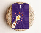Black Love Goose graphic tee by Anchored Grace Boutique featuring a colorful goose illustration on soft cotton fabric.
