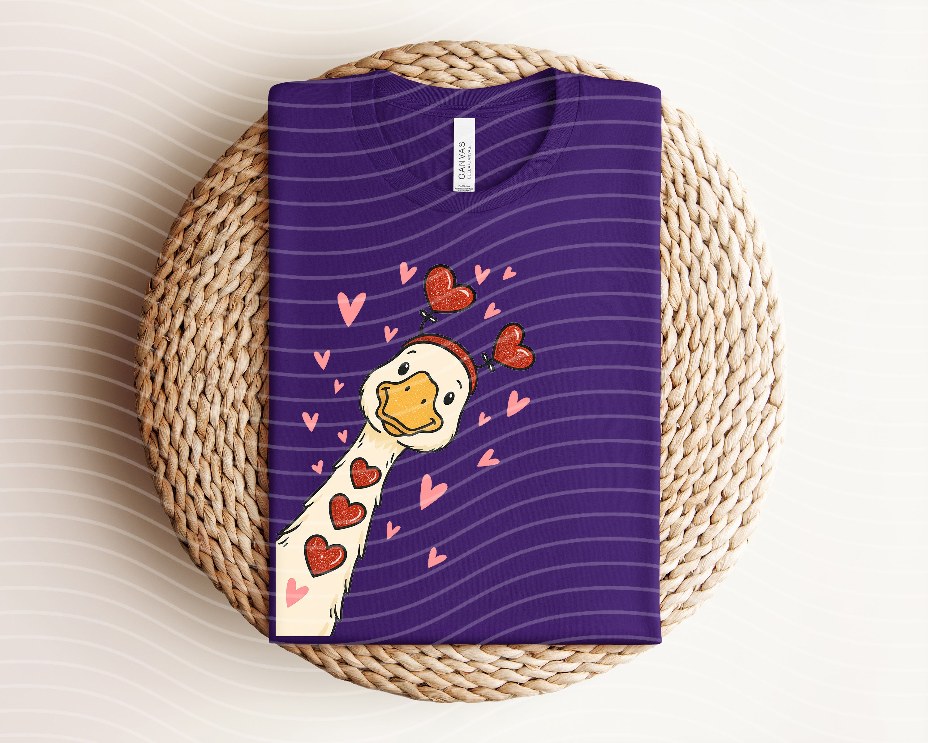 Black Love Goose graphic tee by Anchored Grace Boutique featuring a colorful goose illustration on soft cotton fabric.