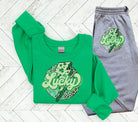 Black Lucky graphic tee by Anchored Grace Boutique featuring bold, colorful lucky-themed design on soft cotton fabric.