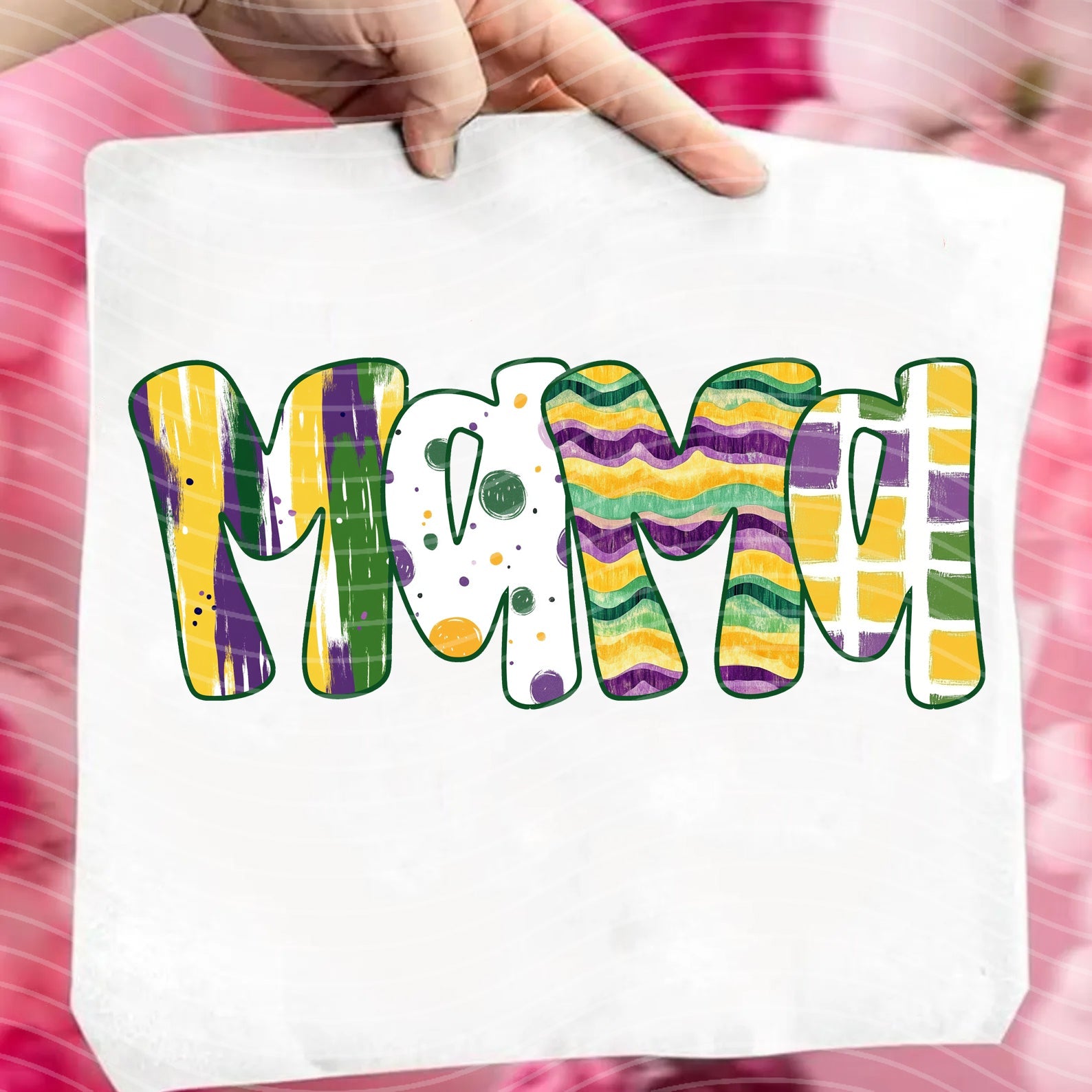 Mama Mardi Gras graphic tee from Anchored Grace Boutique featuring festive Mardi Gras design and bold lettering on soft fabric.