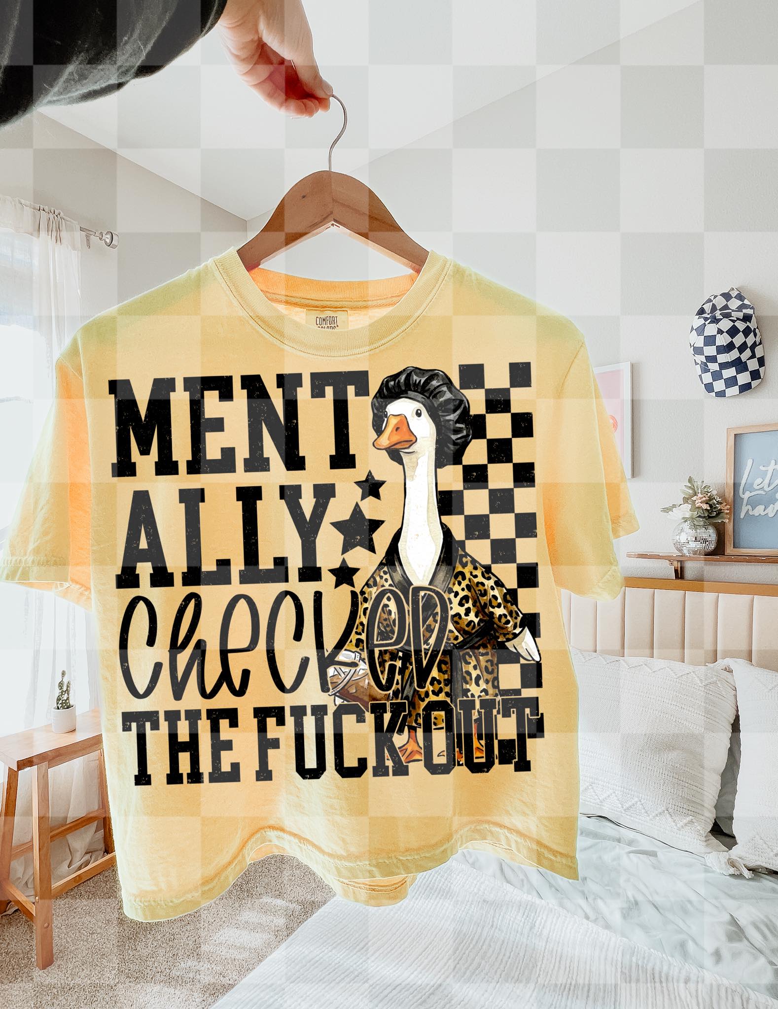 Mentally Checked Out graphic tee from Anchored Grace Boutique featuring a casual design with text on soft fabric.