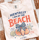 Mentally I am at the Beach graphic tee by Anchored Grace Boutique, featuring a relaxed beach-themed design on a comfortable cotton shirt.