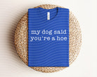 Black graphic tee for women featuring humorous "My Dog Said You're a Hoe" design from Anchored Grace Boutique.