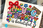 Neurodiversity is Beautiful graphic tee from Anchored Grace Boutique, featuring colorful neurodiversity pride design on soft cotton fabric.