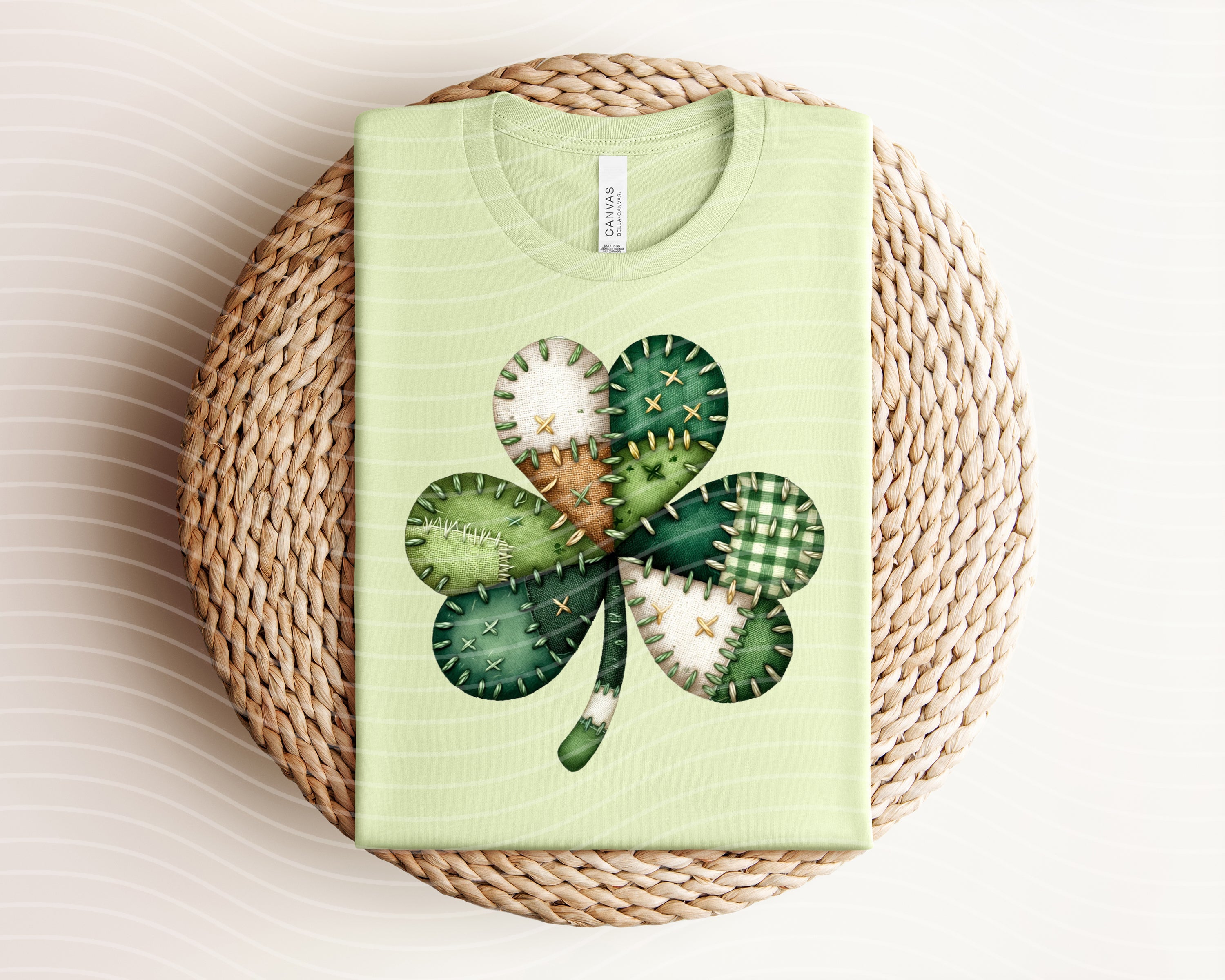 Patchwork clover graphic tee from Anchored Grace Boutique, featuring colorful patchwork design and a playful clover graphic.