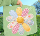 Patchwork Daisy graphic tee from Anchored Grace Boutique featuring colorful floral patchwork design on a casual cotton t-shirt.