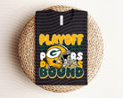 Green Packers graphic tee by Anchored Grace Boutique featuring playoff bound design and team logo on soft cotton fabric.