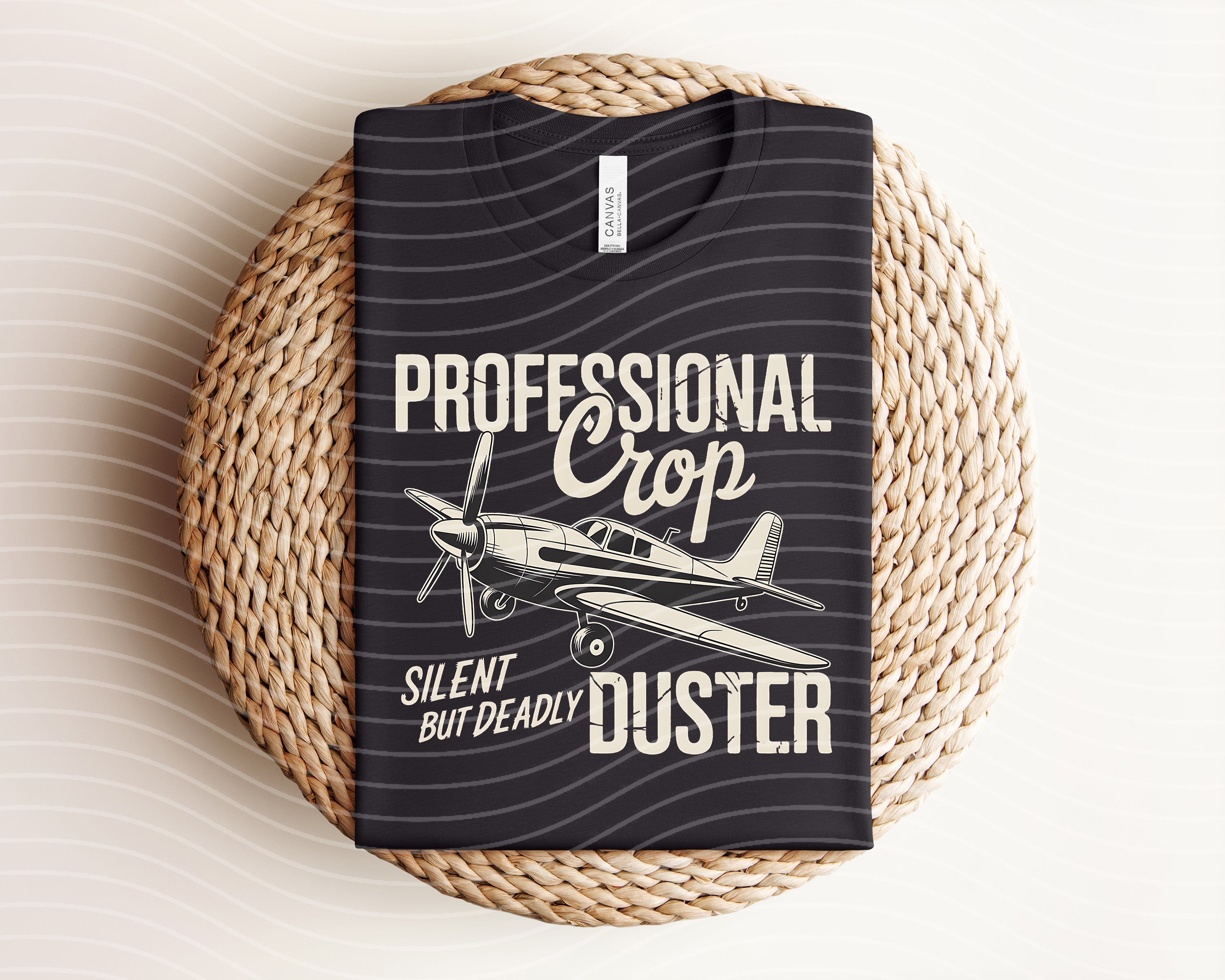 Black graphic tee featuring a crop duster airplane design from Anchored Grace Boutique, casual and stylish for everyday wear.