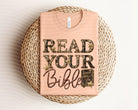 Read Your Bible graphic tee by Anchored Grace Boutique, featuring a stylish design on a comfortable casual T-shirt.