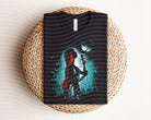 Sally Dark Graphic Tee by Anchored Grace Boutique featuring a bold graphic design on a black casual T-shirt.
