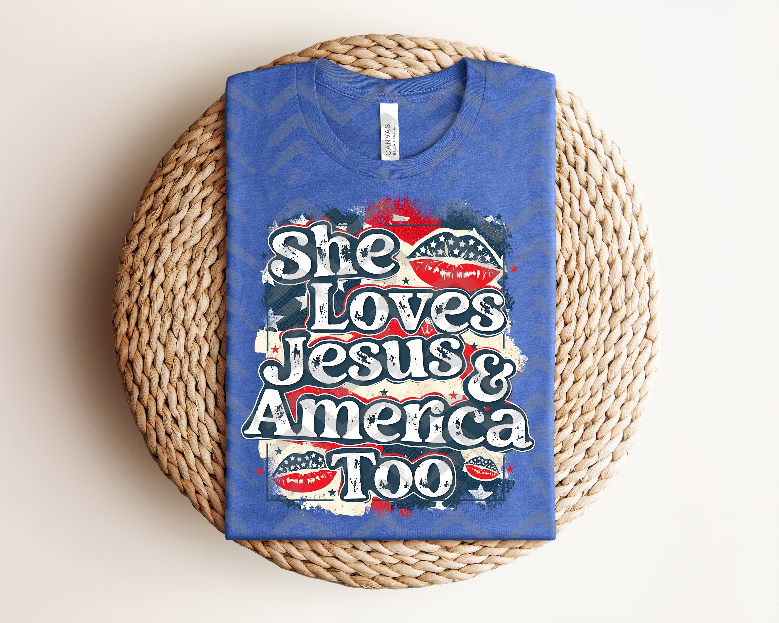 White graphic tee from Anchored Grace Boutique featuring "She Loves Jesus & America Too" message, casual style, and comfortable fit.