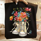 Gray graphic tee with daisy flower print from Anchored Grace Boutique, featuring a casual fit and floral design.