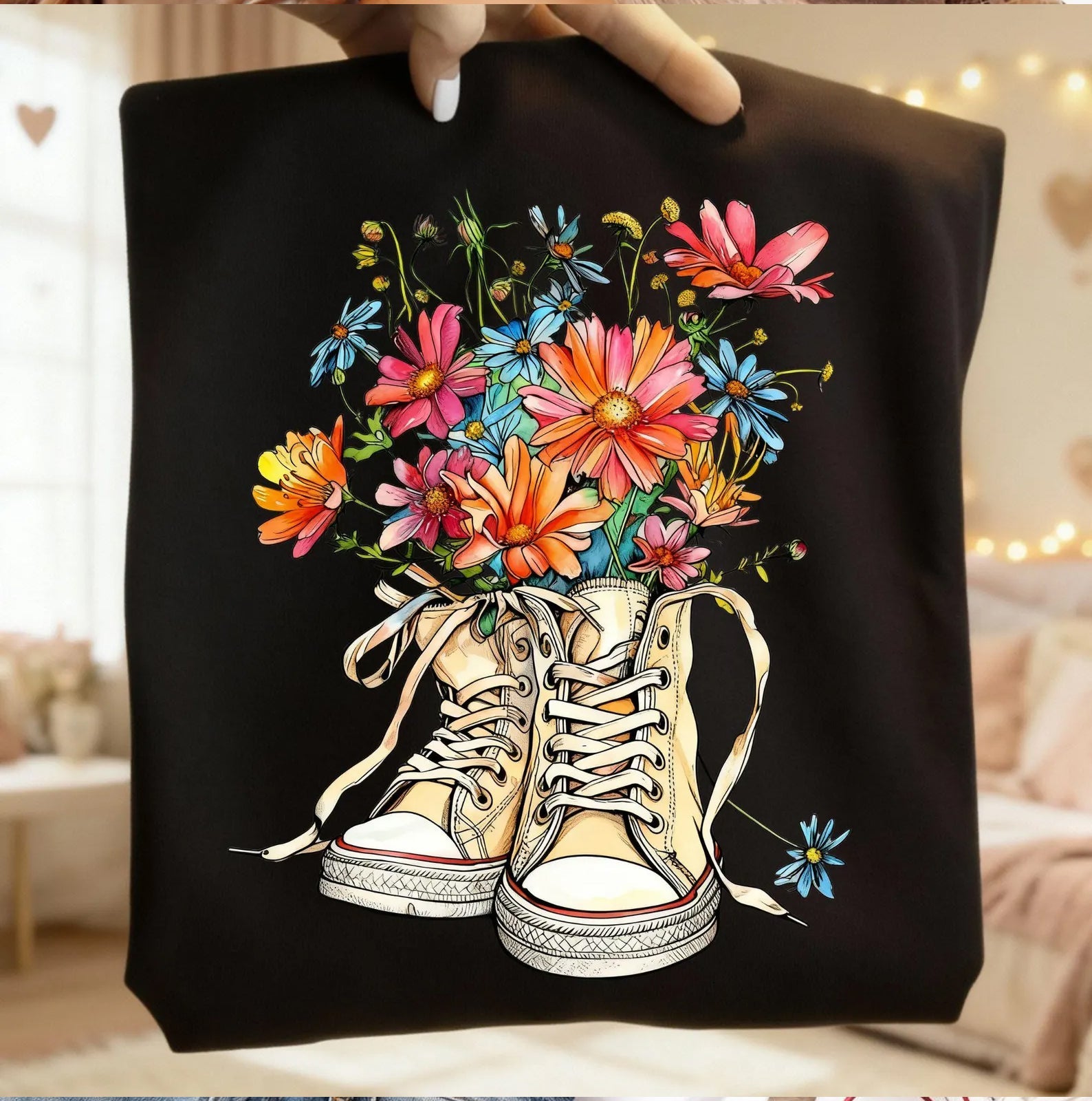 Gray graphic tee with daisy flower print from Anchored Grace Boutique, featuring a casual fit and floral design.