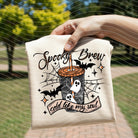 Spooky Brew graphic tee by Anchored Grace Boutique showing a Halloween-themed spooky brew design on a casual tee.