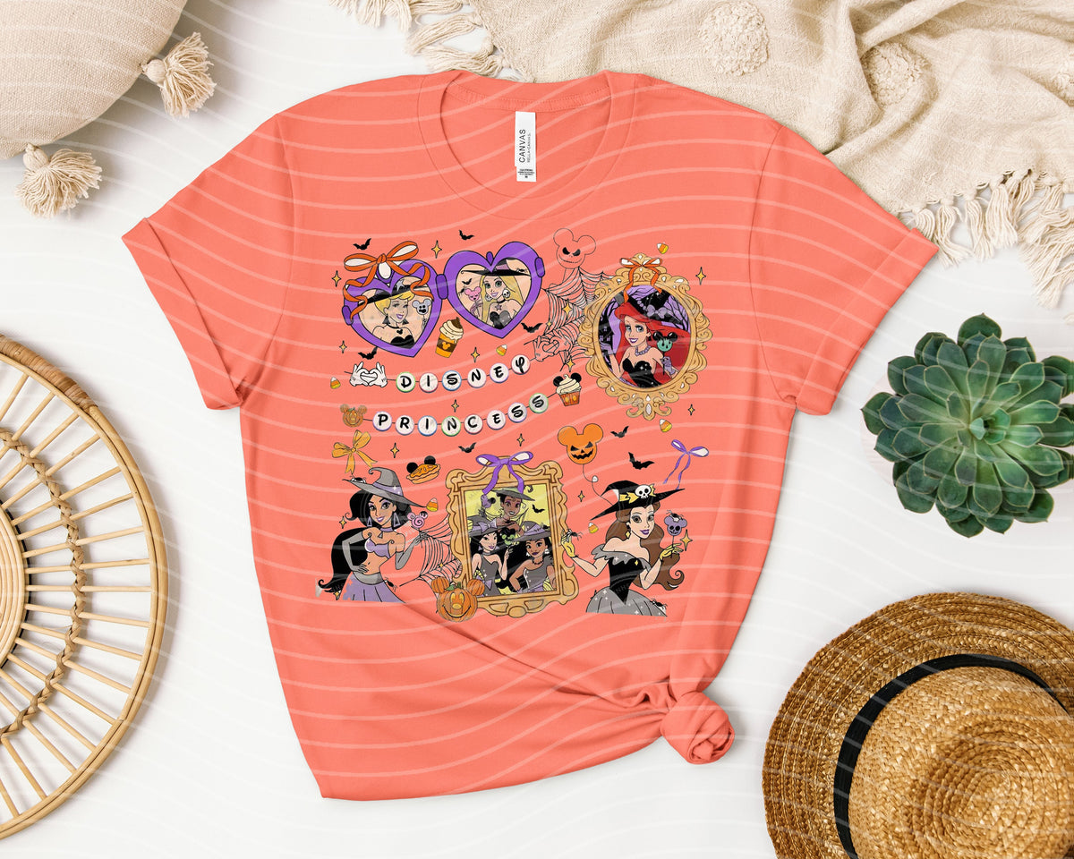 Black graphic tee by Anchored Grace Boutique featuring a spooky princess design and colorful Halloween-themed artwork.