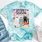 Spooky Season Graphic Tee by Anchored Grace Boutique featuring Halloween-themed spooky graphics on a casual tee.