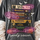 Spooky Season Movies graphic tee by Anchored Grace Boutique featuring Halloween-themed movie graphics on a casual t-shirt.