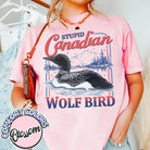 Stupid Canadian Wolf Bird graphic tee by Anchored Grace Boutique featuring a playful wolf and bird design on a casual t-shirt.