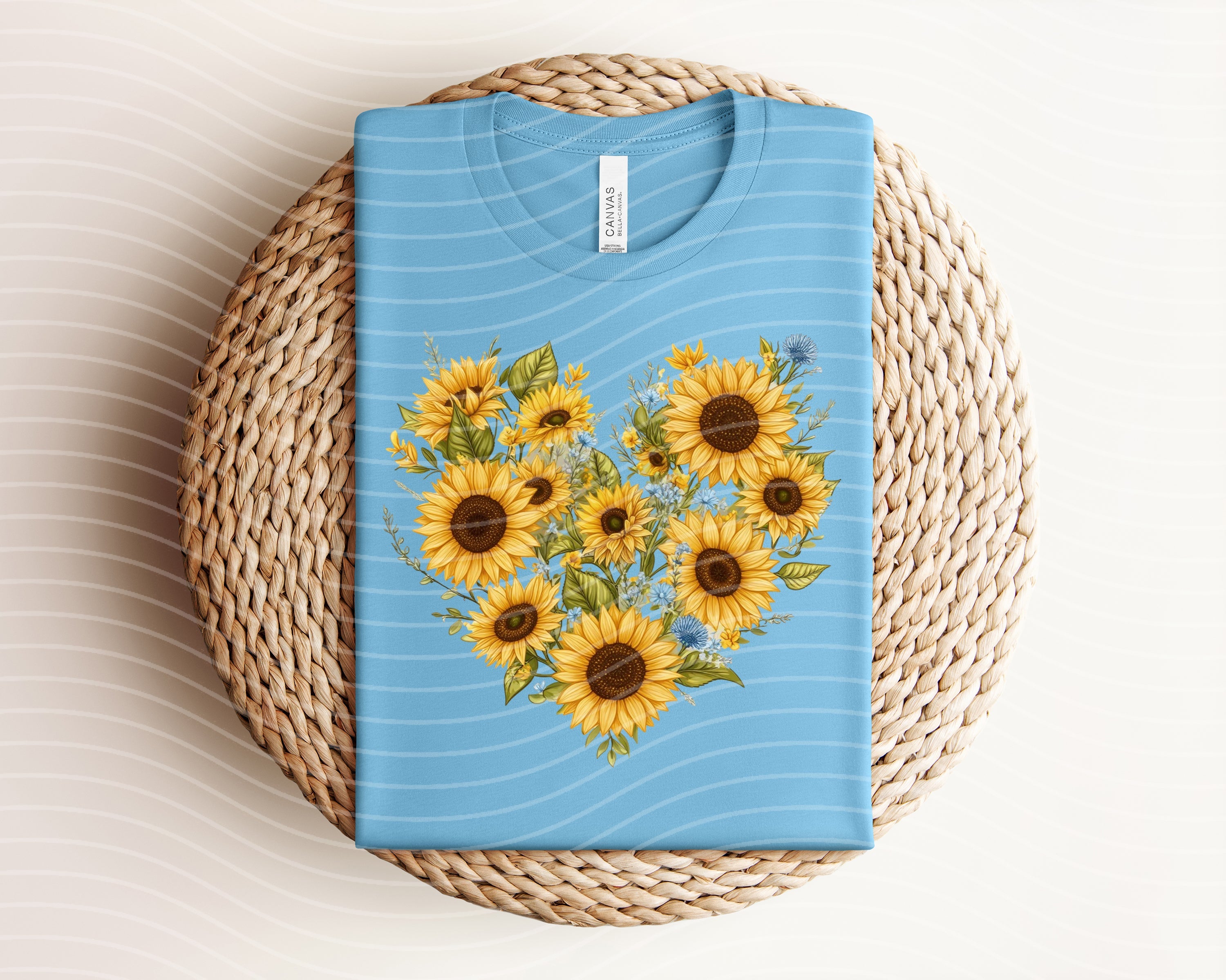 Sunflower heart graphic tee from Anchored Grace Boutique, featuring a vibrant sunflower and heart design on a casual cotton t-shirt.
