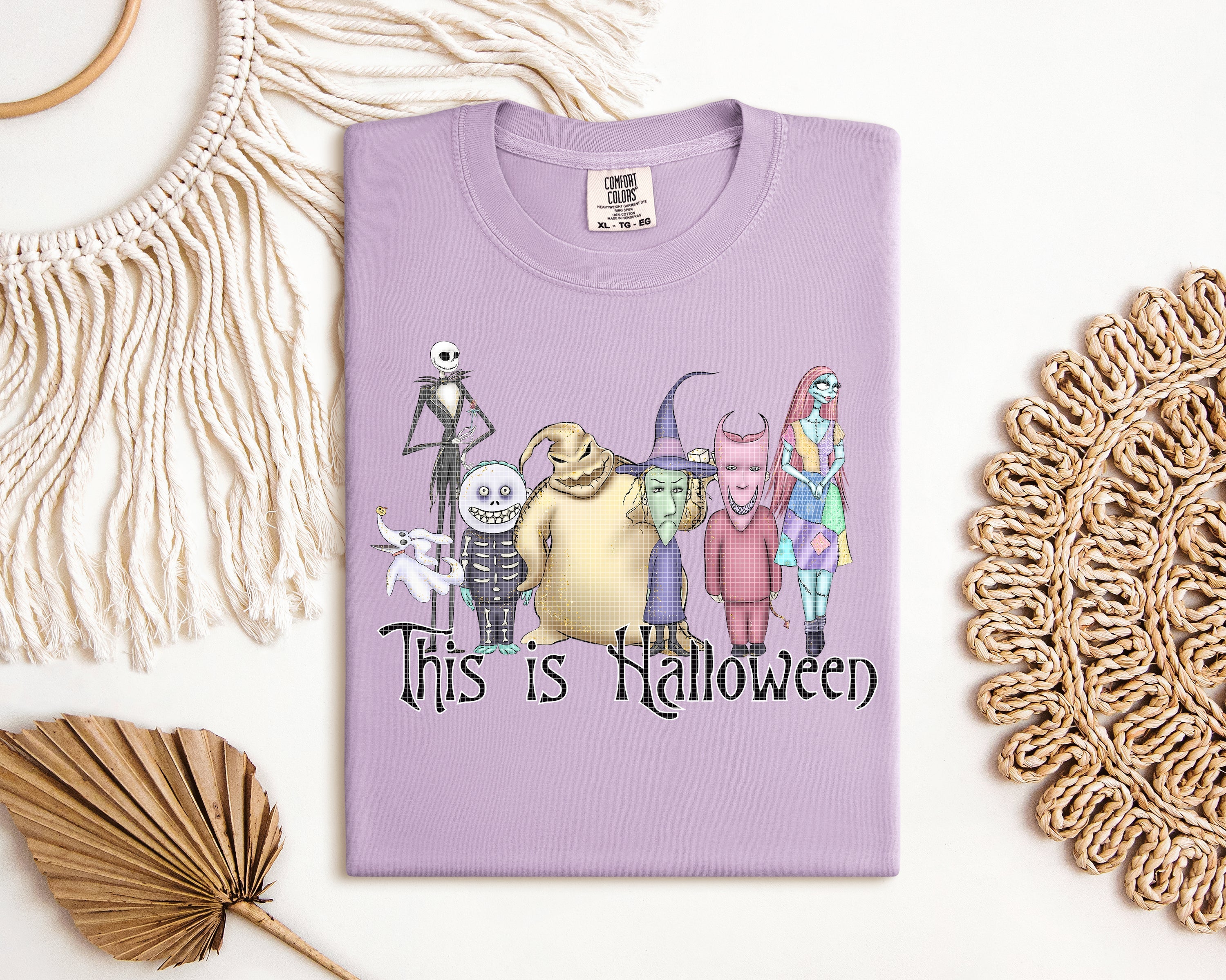 Halloween graphic tee by Anchored Grace Boutique featuring spooky seasonal design on a casual t-shirt.
