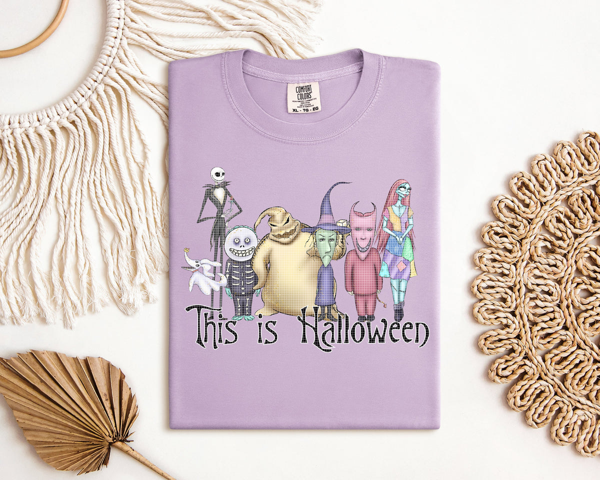 Black Halloween graphic tee from Anchored Grace Boutique featuring spooky seasonal designs and bold lettering.