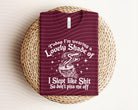 Woman wearing a graphic tee with "Today I'm a Wearing a Lovely Shade Of" printed, by Anchored Grace Boutique.