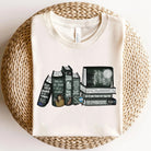 Twilight Books graphic tee by Anchored Grace Boutique, featuring a dark-themed design with book-related artwork on a black cotton t-shirt.