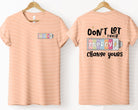 Don't Let Their Energy Change Yours graphic tee by Anchored Grace Boutique, front view showing vibrant design and casual fit.