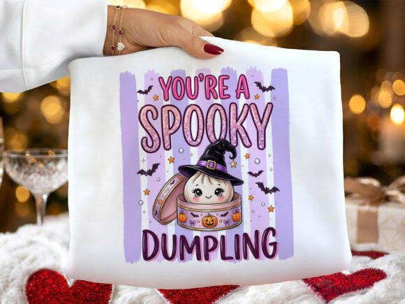 You're a Spooky Dumpling graphic tee from Anchored Grace Boutique featuring a playful spooky dumpling illustration on soft fabric.