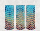 Glitter Wave 20 oz skinny tumbler by Anchored Grace Boutique with a shiny, colorful glitter wave design on a stainless steel body.