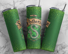 Slytherin 20 oz skinny tumbler from Anchored Grace Boutique with green and silver design and Slytherin logo.