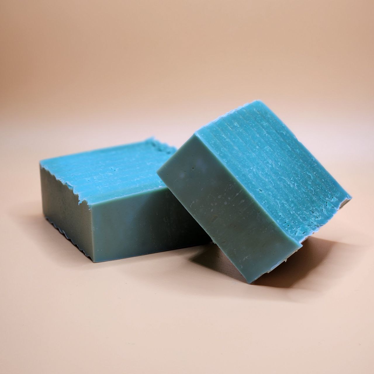 Bar of Ancient Health & Healings Methylene Blue Tallow Soap with lavender and mint scent, showing the soap's textured surface and packaging