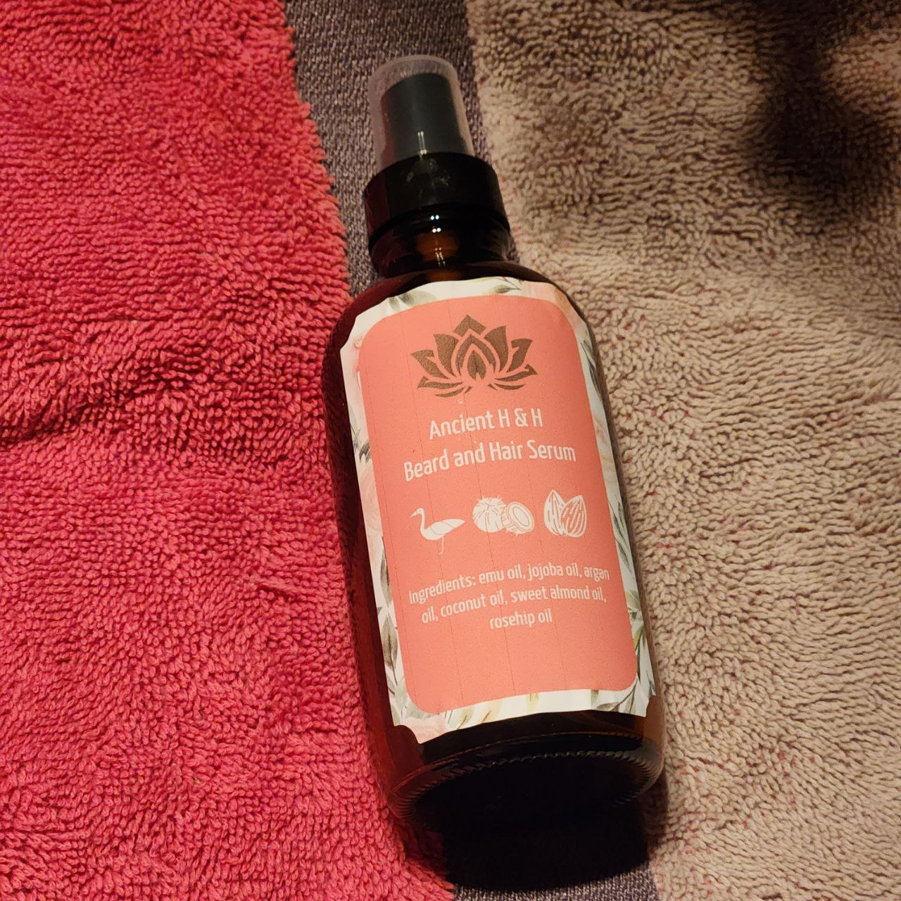Ancient Health & Healings beard and hair conditioner with emu oil, showing a sleek bottle with a pump dispenser and natural ingredients.